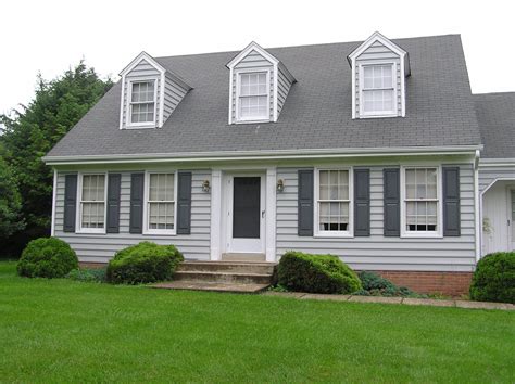 gray siding with black shutters.